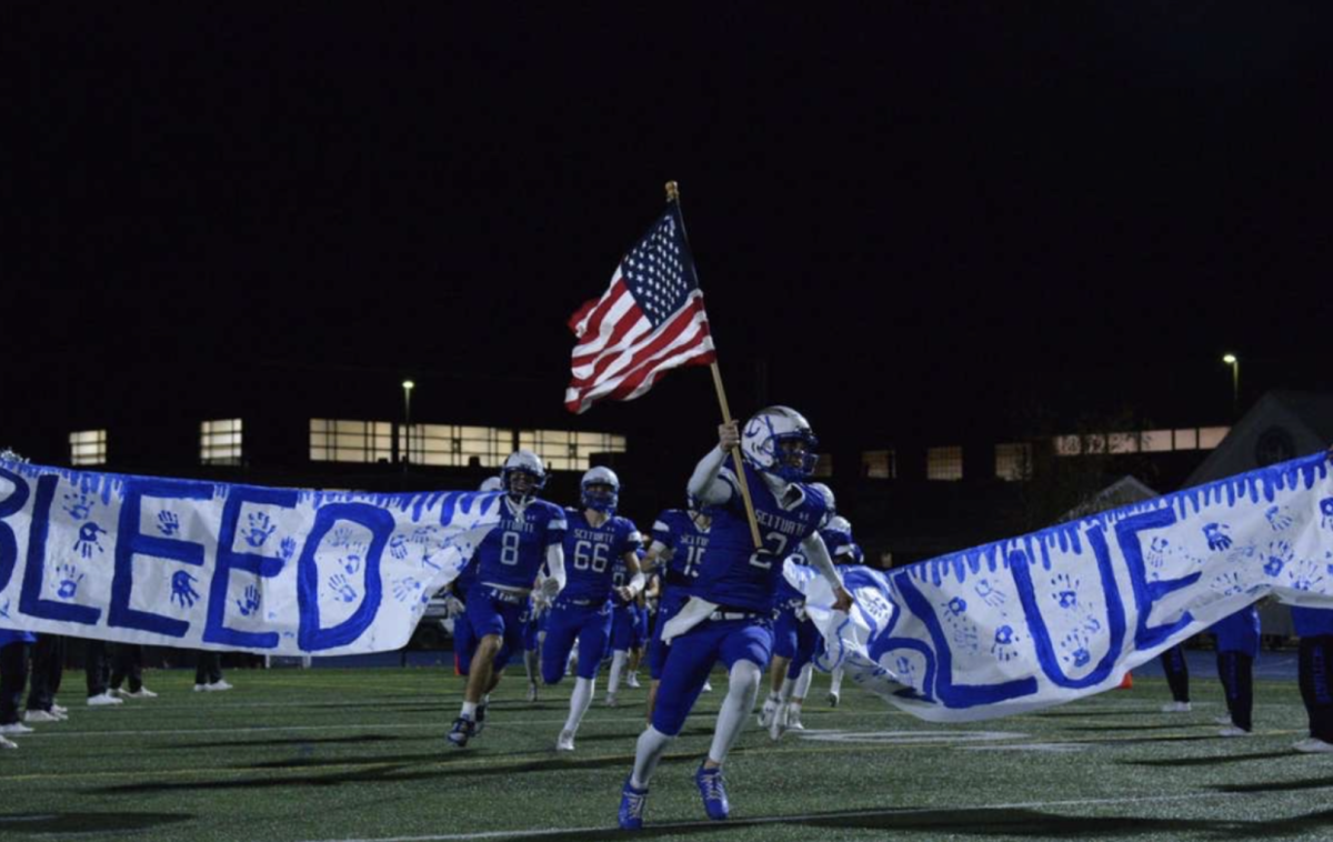 SHS quarterback Jonny Donovan leads the team to the field on Friday, November 15th. Donovan was selected as player of the week.